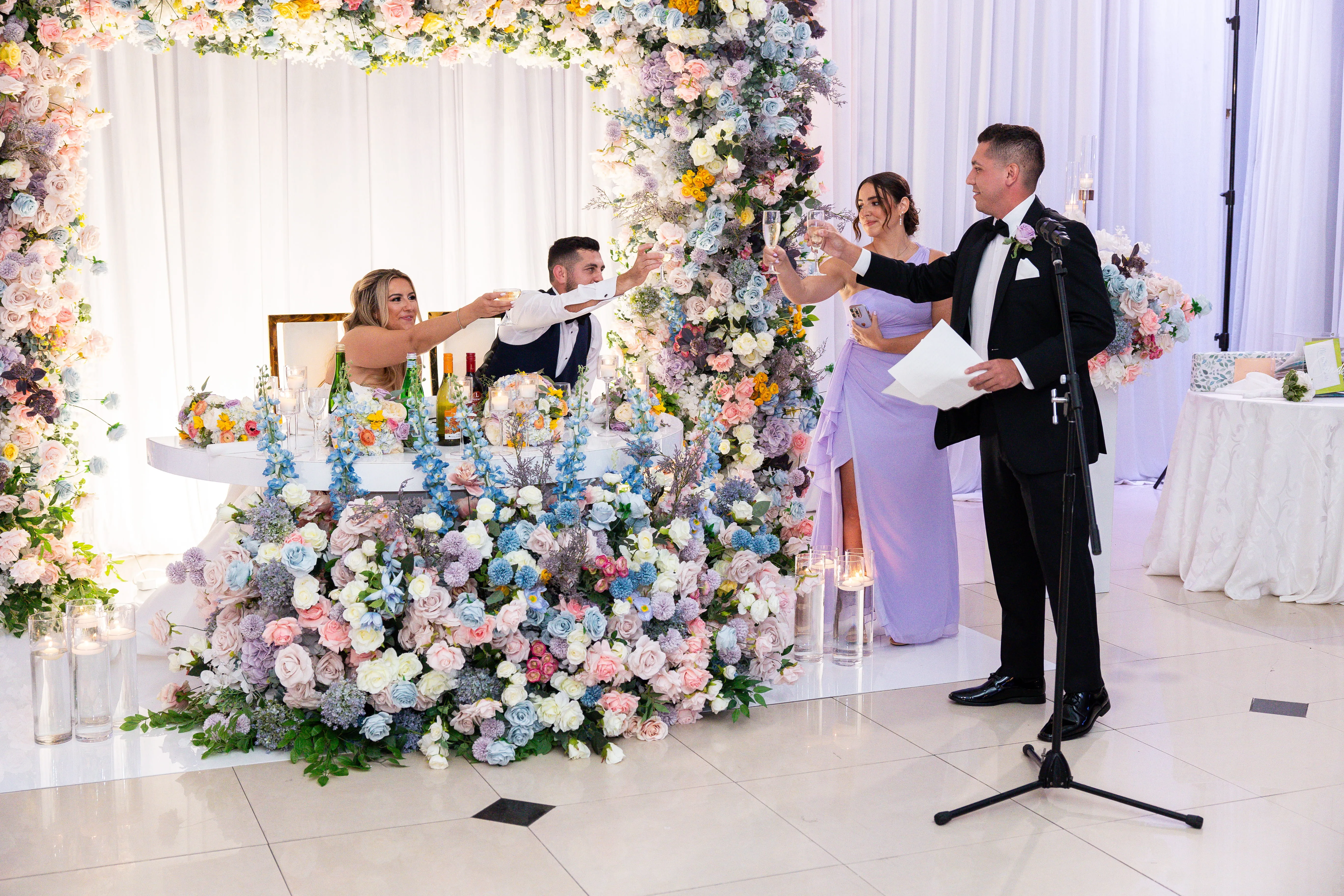 Elegant wedding reception ballroom with chandelier lighting and upscale atmosphere