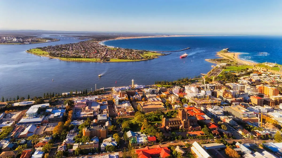 Aerial view of a coastal city with harbor and bay