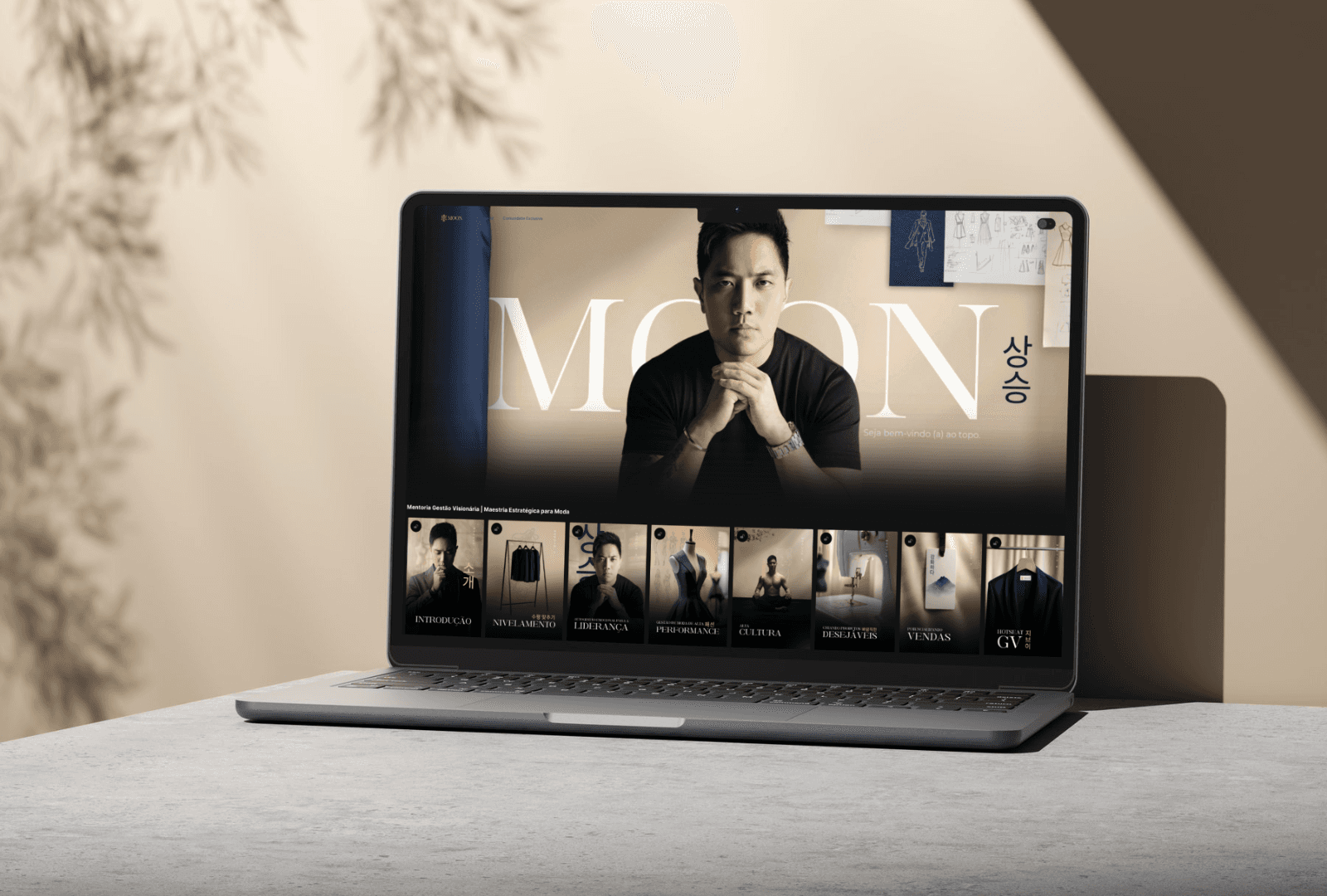 Modern white house with glass walls on a cliff, overlooking the ocean at sunset. Vibrant flowers and a large moon create a serene, dreamy atmosphere.