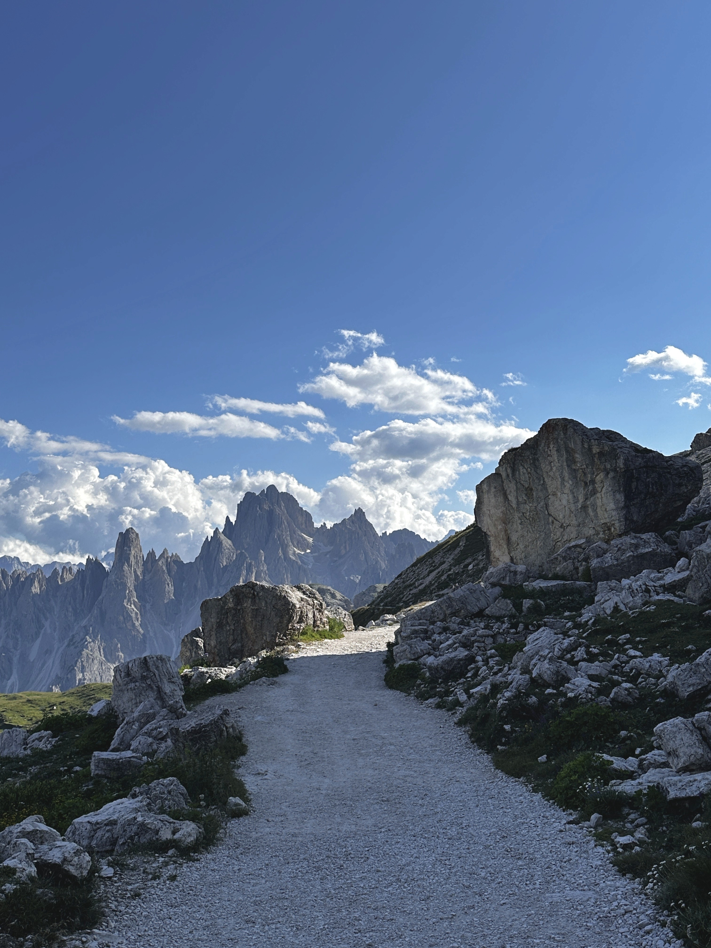 a group of people walking on a sidewalk