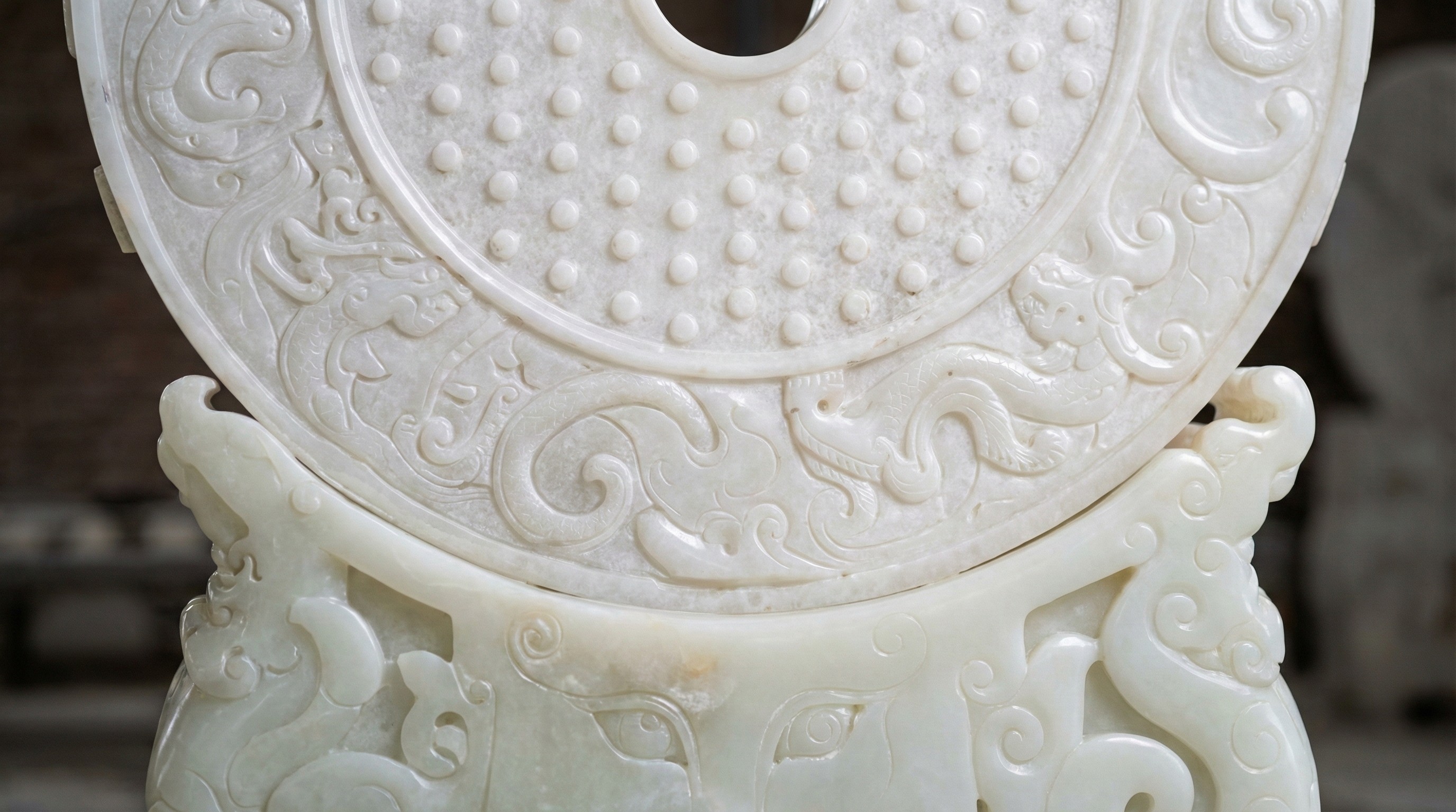 Detailed texture of a white marble Bi-disk featuring traditional grain (Guwen) and cloud motifs by NOVA STONE.