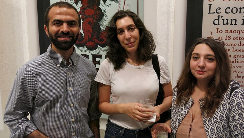 Three people smiling
