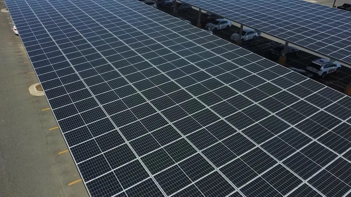 Solar carport rows during a cleaning in Wasco, CA