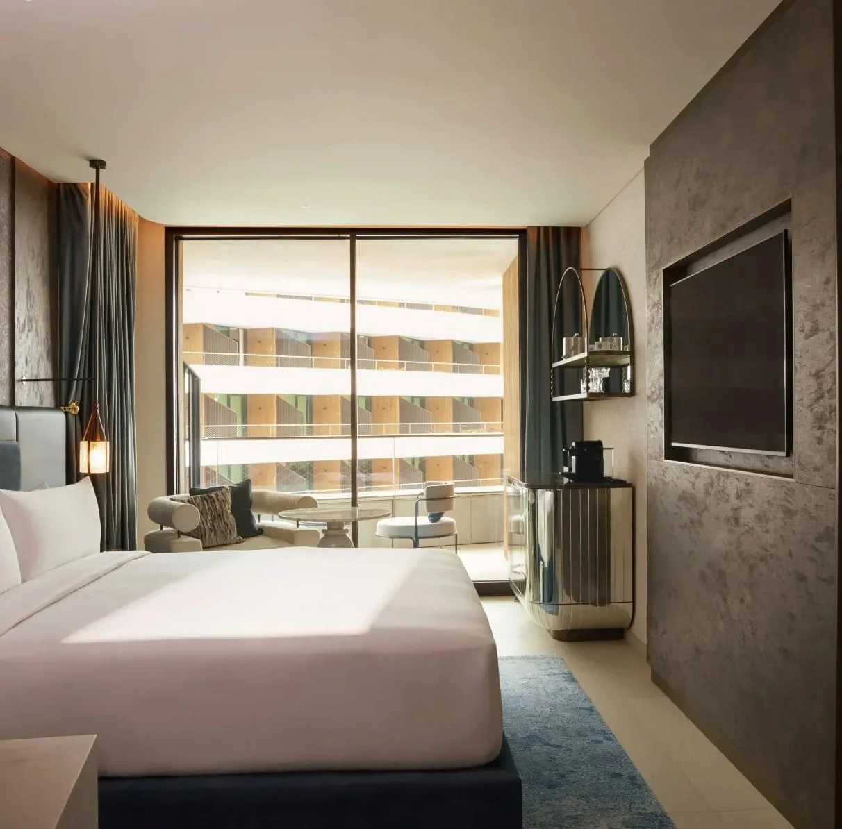 Golden cross atop a domed building with blue sky.