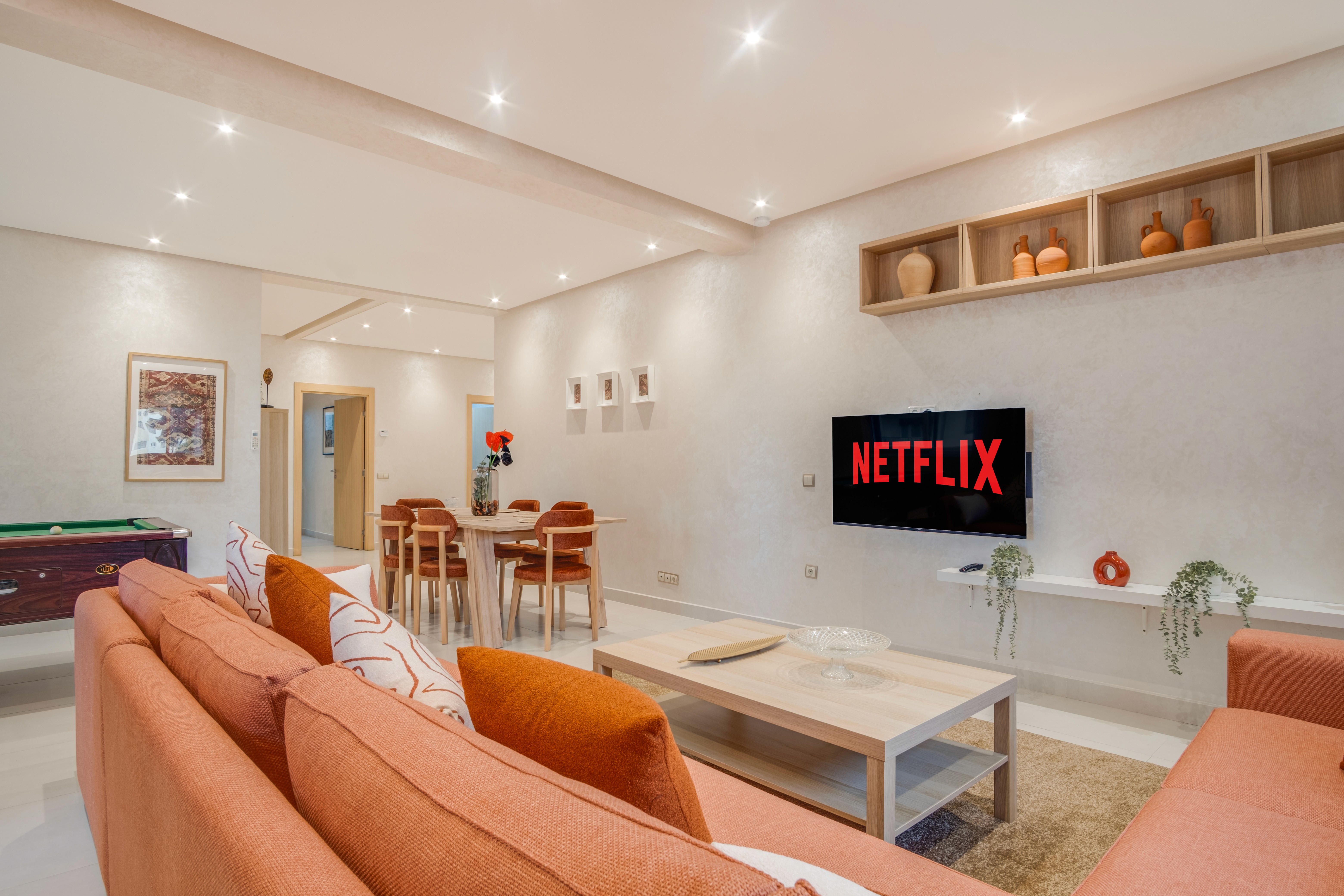 A man stading with Surfboard