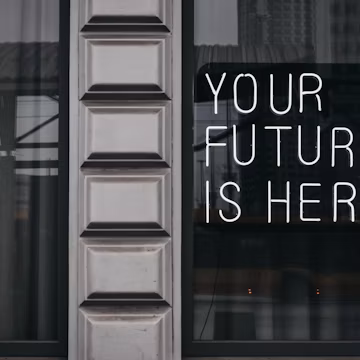 a window with a sign that says your future is here