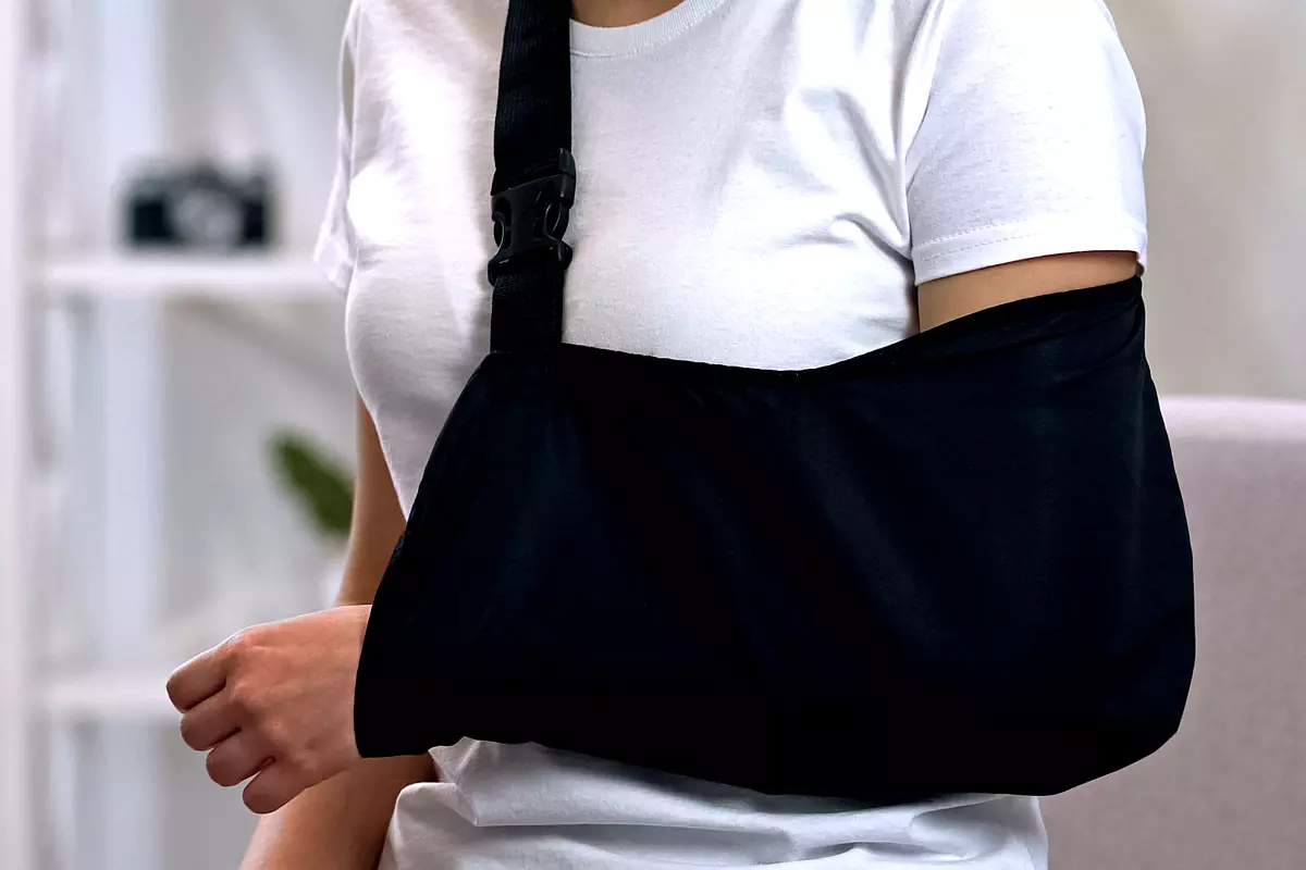 Person wearing an arm sling after an injury