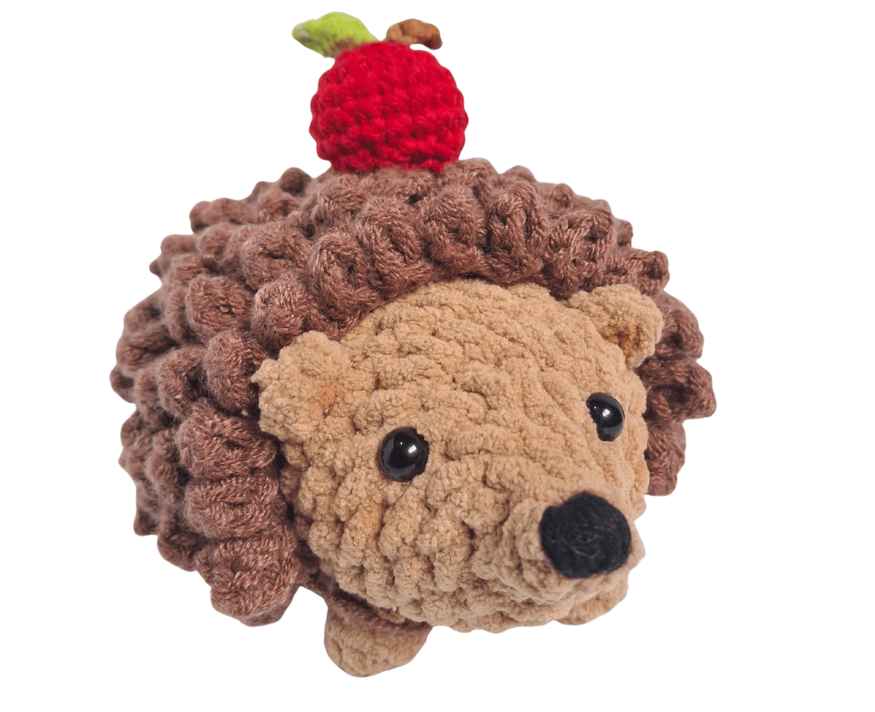 A handcrafted knitted hedgehog toy featuring a soft cream-colored body and intricately detailed, textured brown spines, perfect for children and collectors.