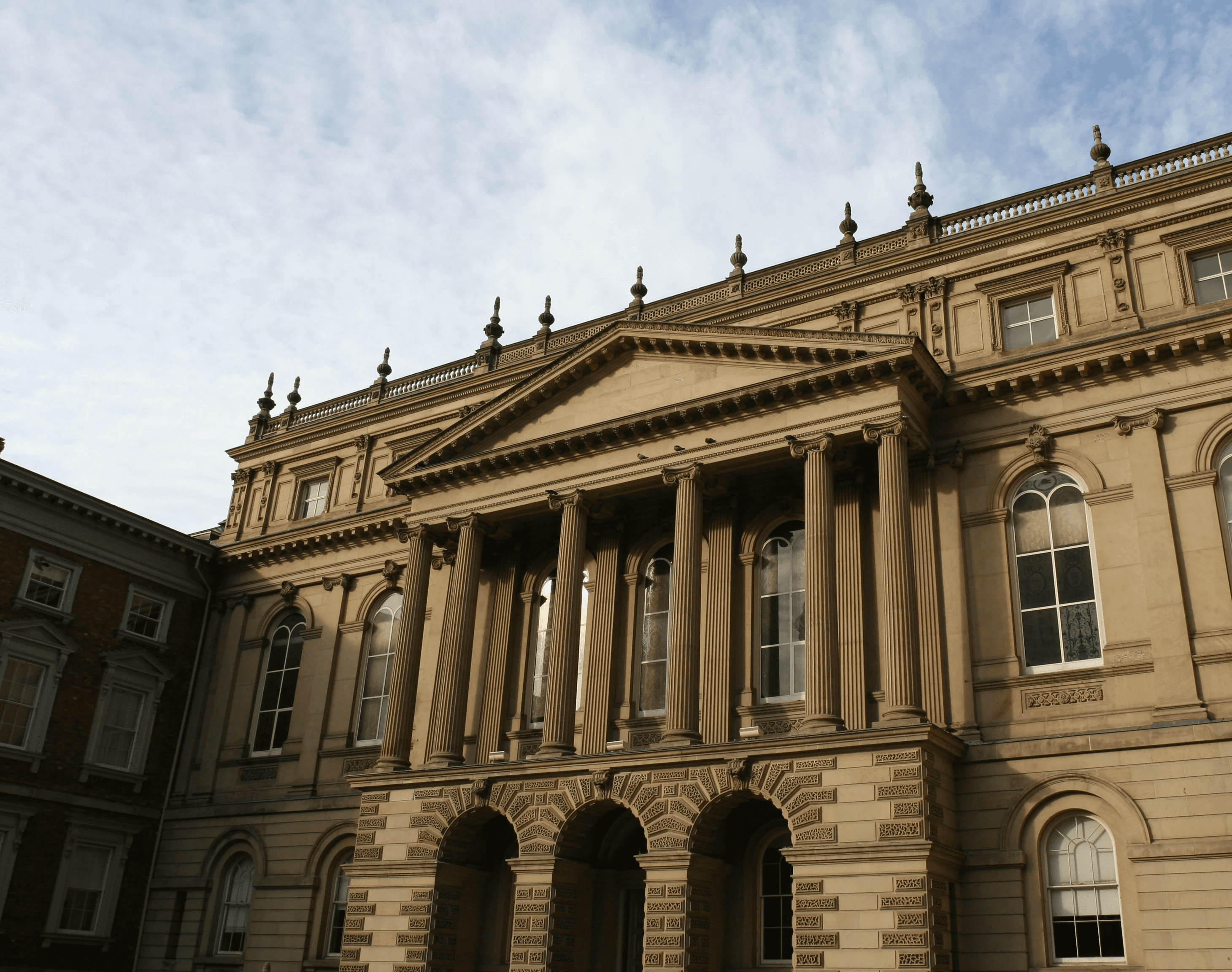 lurred crowd of people walking through a busy airport or transit terminal.