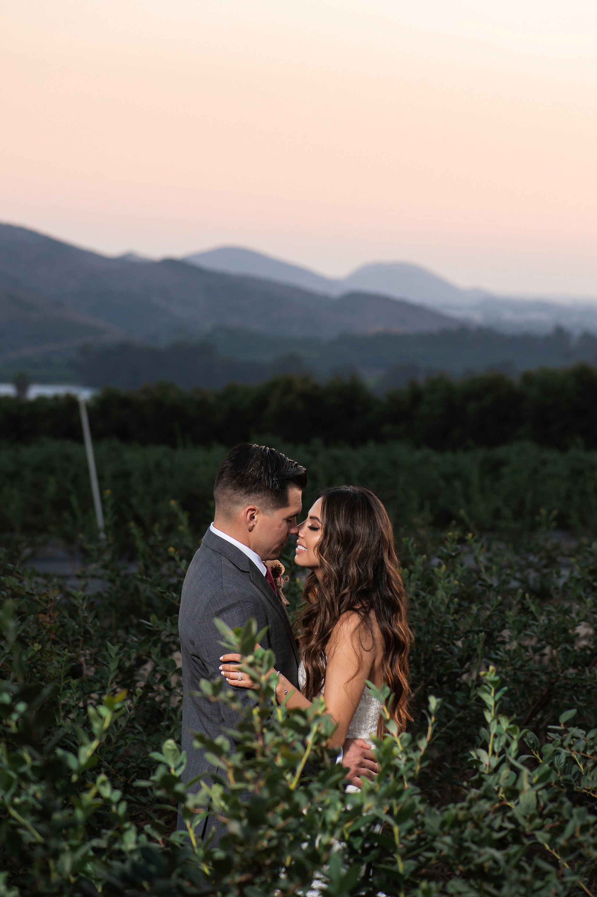 Bride and groom portraits with mountains in the background at Gerry Ranch