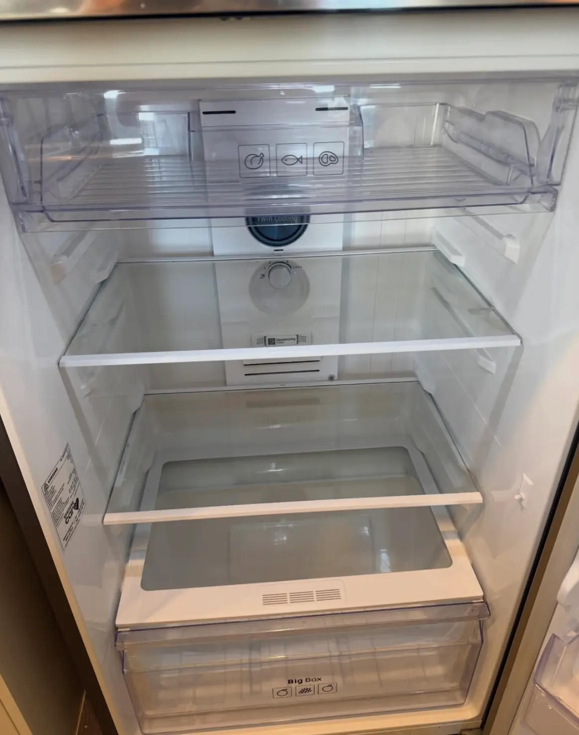 Spotless and sanitized interior of a refrigerator after a professional deep clean.