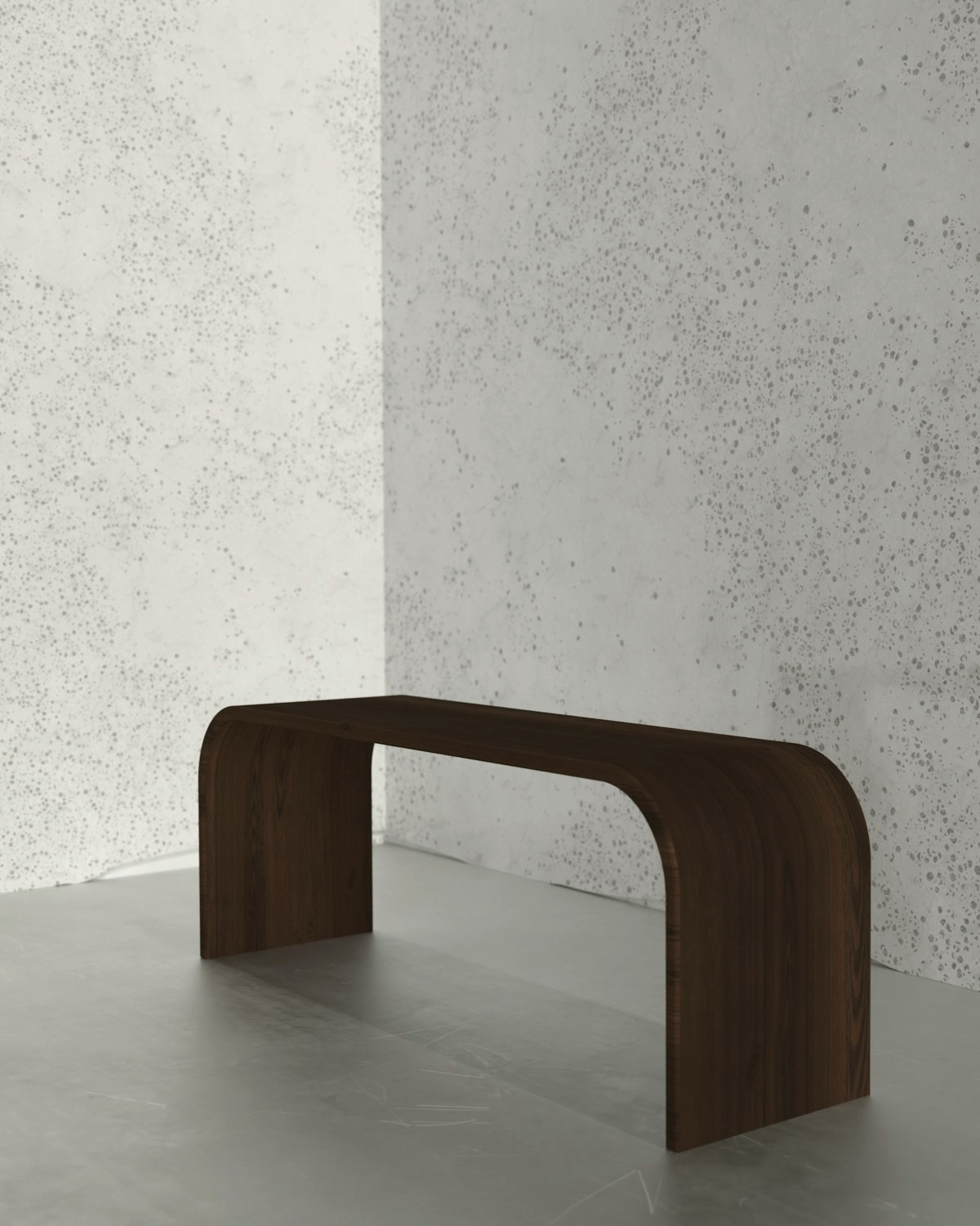 Pebble Low Table in cast stone, photographed against paper