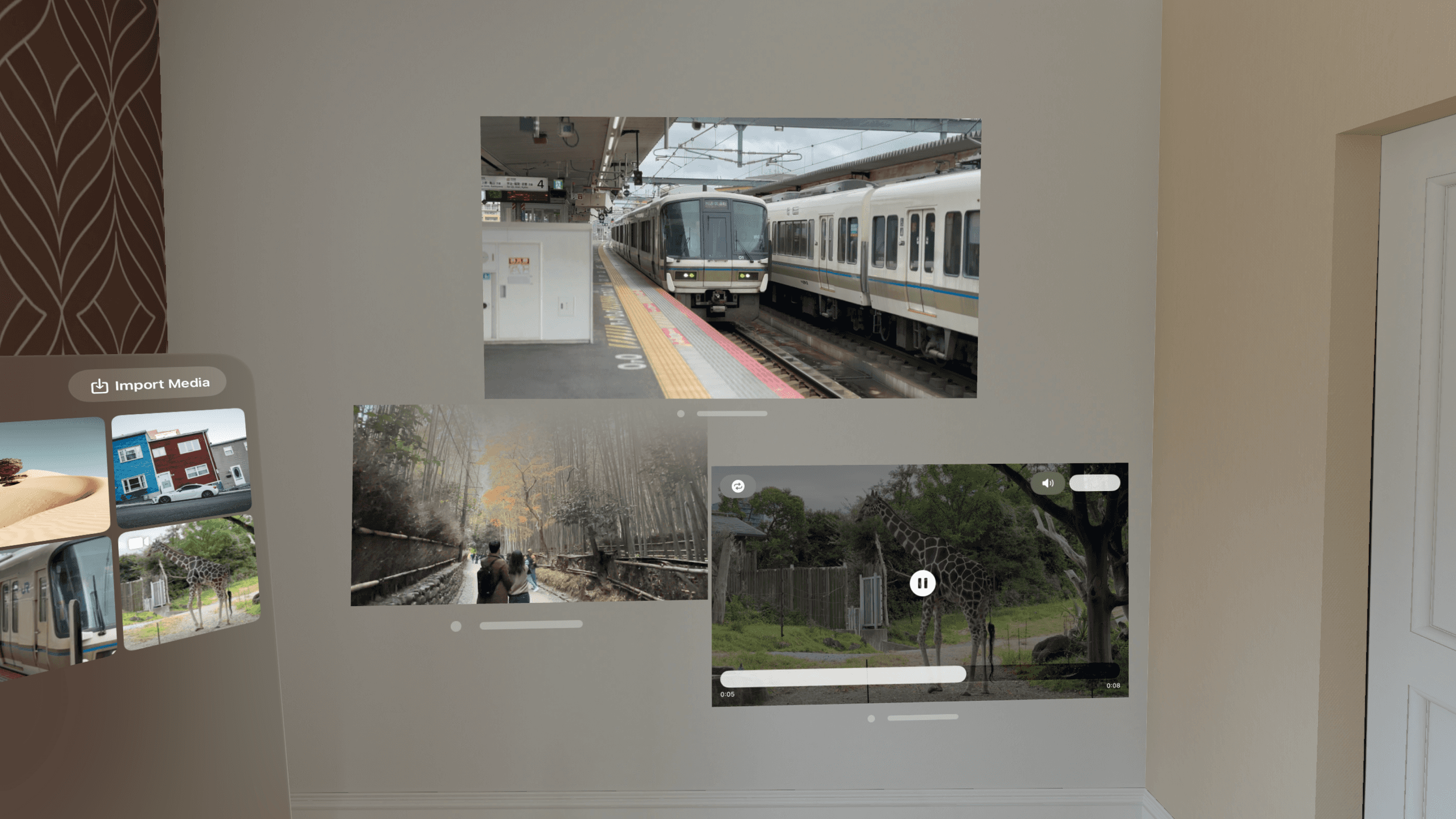 A wall displaying digital screens with photos and videos of a train station, a bamboo forest, and a giraffe in a zoo.