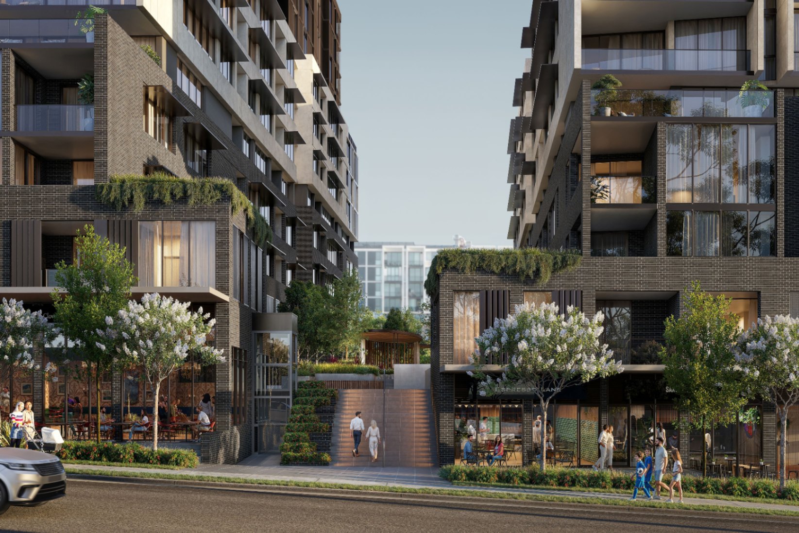Street level view of Lily Lane Carrington Place with cafes and landscaped entry in Castle Hill, off the plan apartments with $10K deposit Coposit