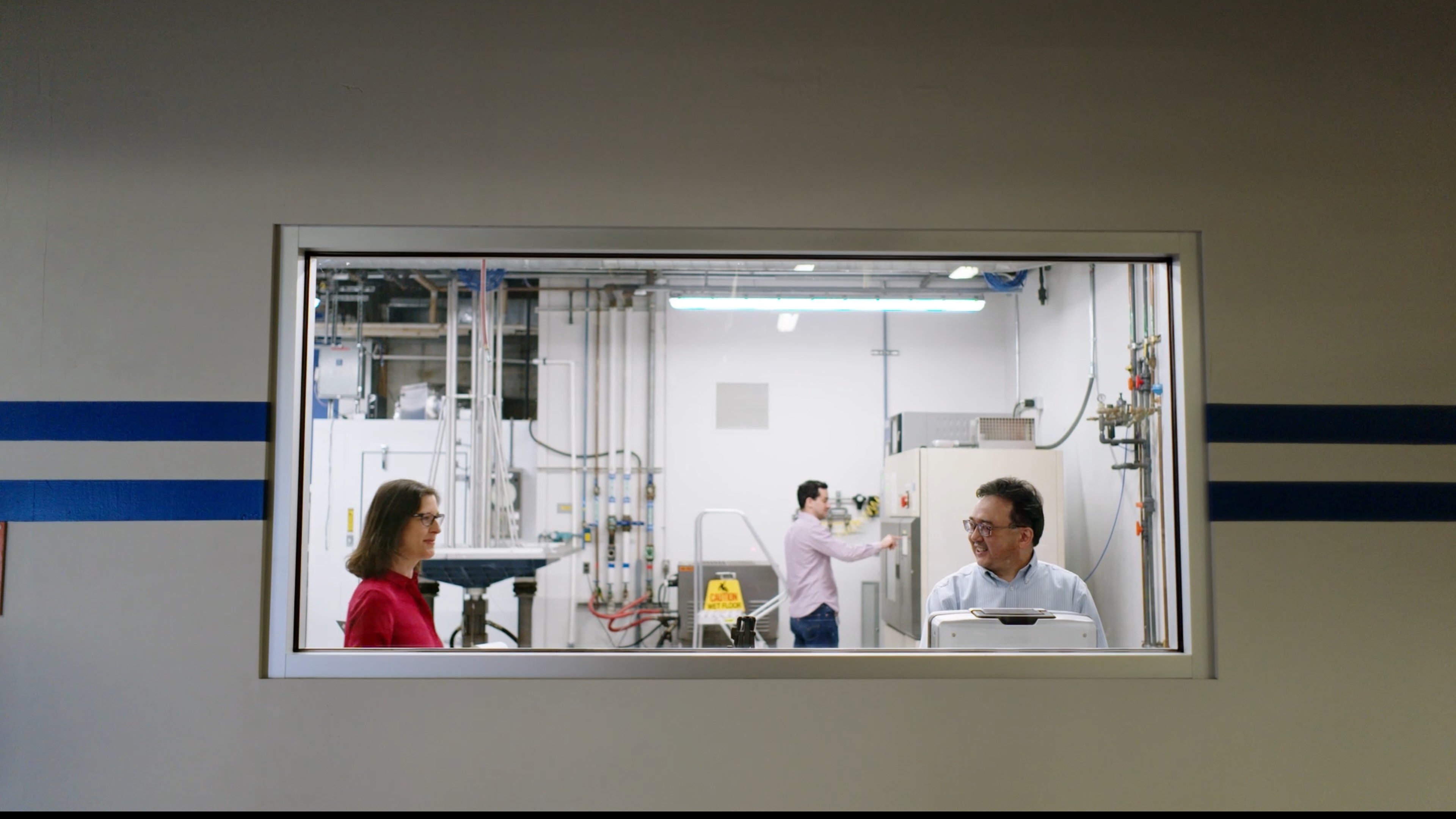 Front cover image for a short film made for Colgate. The image shows a woman speaking to a man framed through a large window.