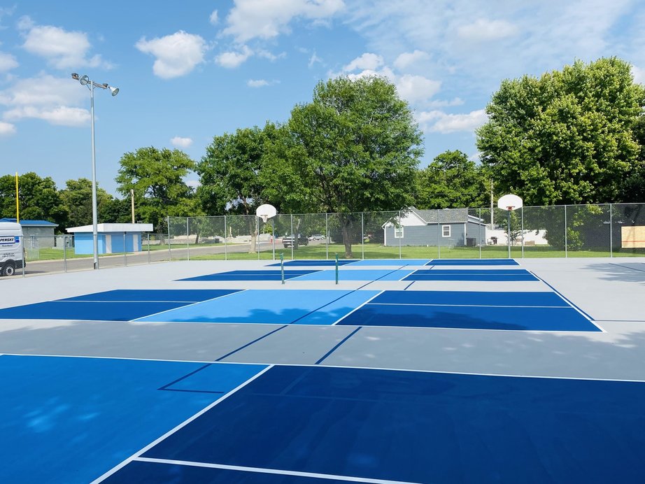 Resurfaced multi-sport courts in Imperial, Nebraska featuring four new pickleball courts with durable acrylic coating