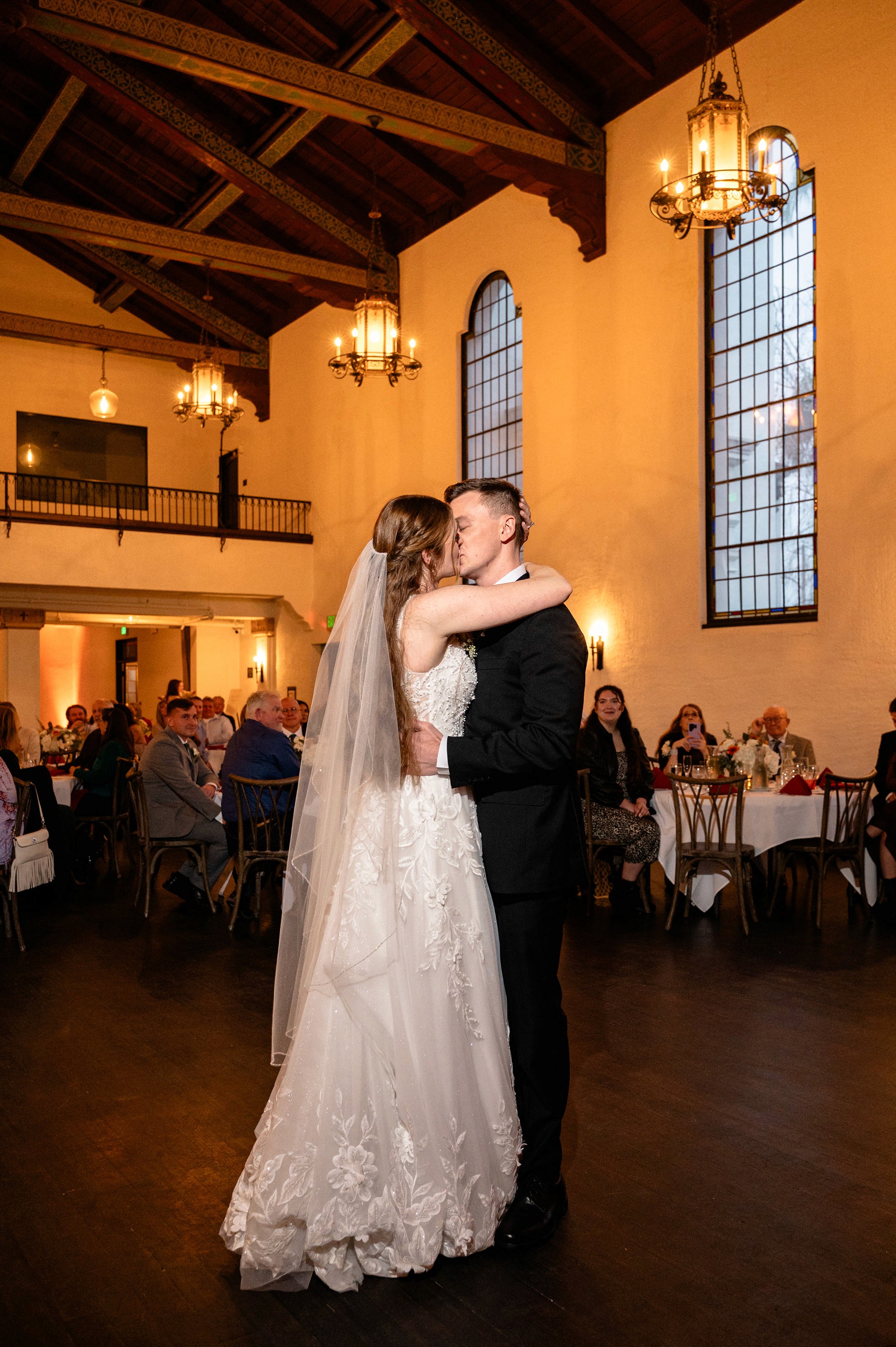 Flat lay wedding details with bouquet, rings, and sparkling bridal heels