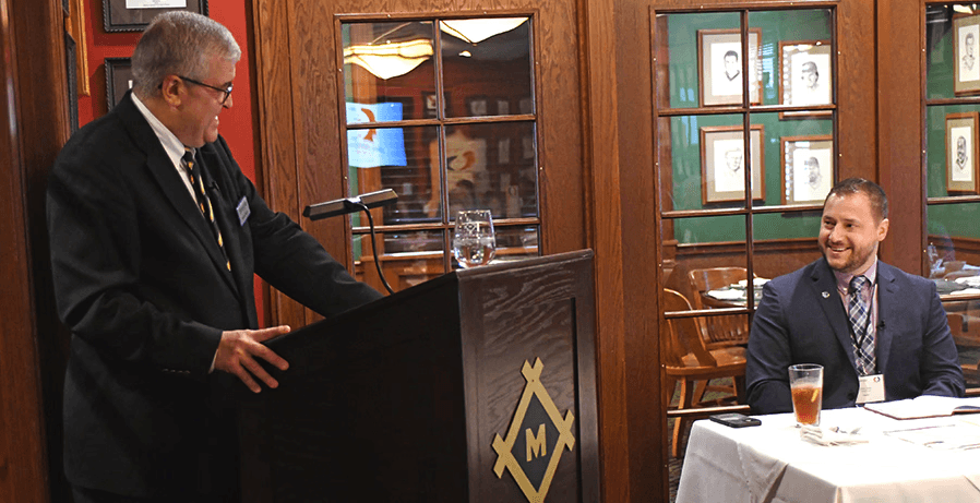 Alex solo from gemini legal smiling in a presentation room