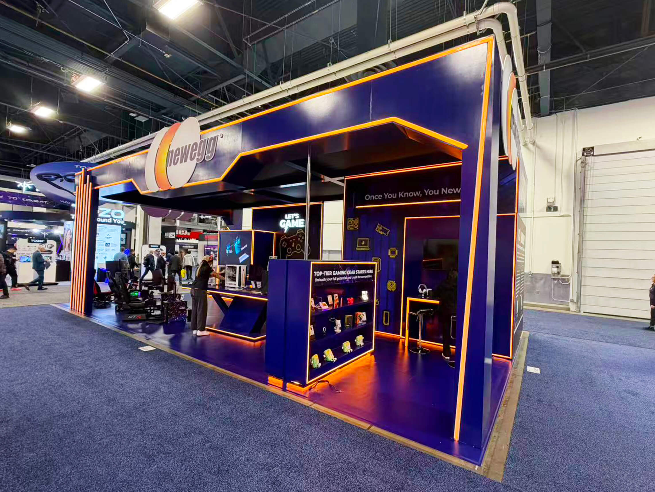 FEC attraction booth at LVCC Las Vegas set with immersive visuals, equipment showcase, and business conversation area