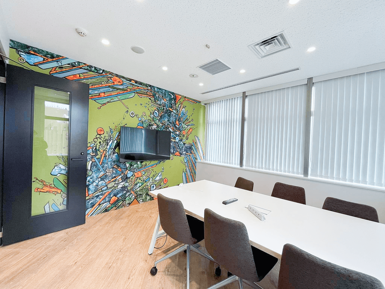 turned off laptop computer on top of brown wooden table