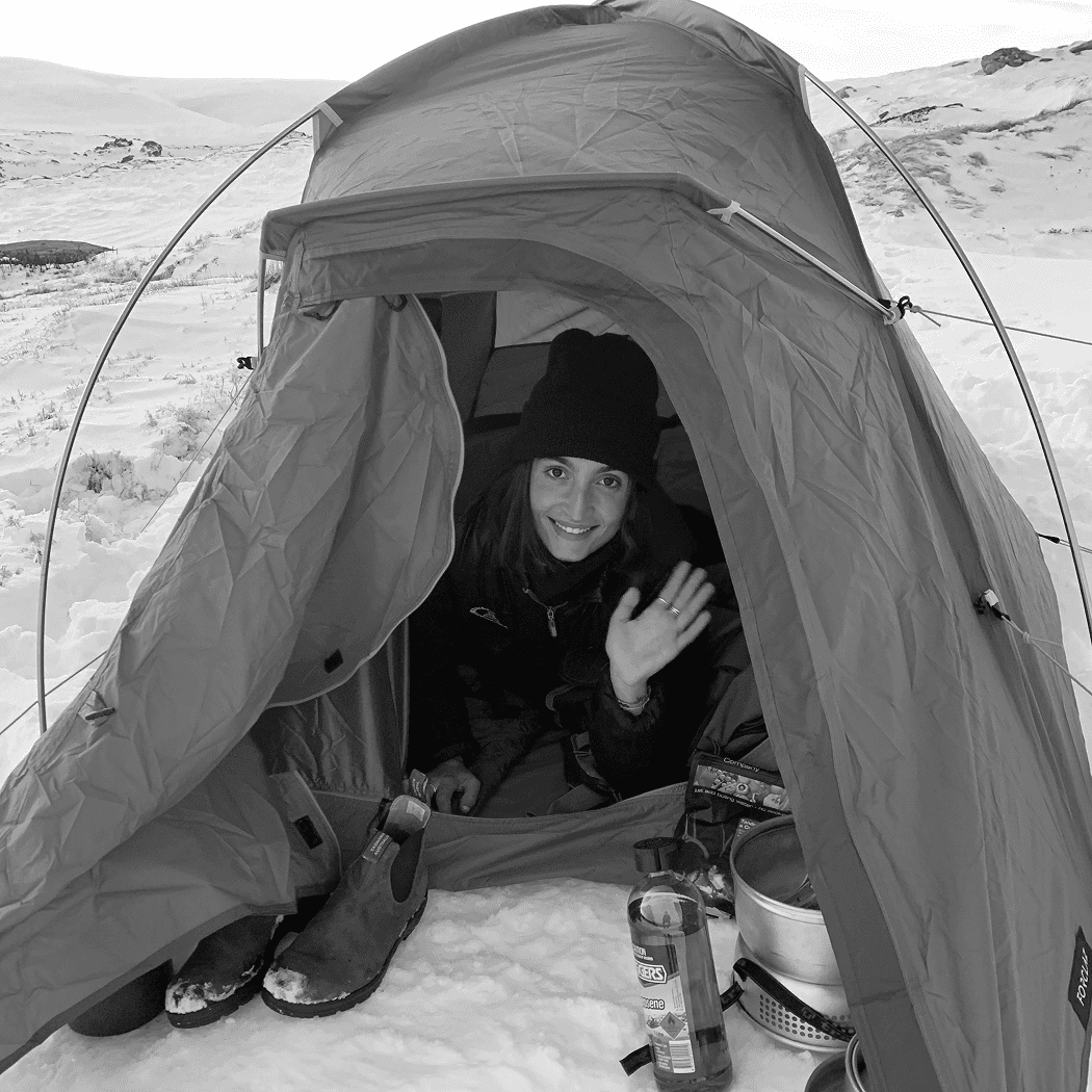 a black and white photo of a woman in a dress
