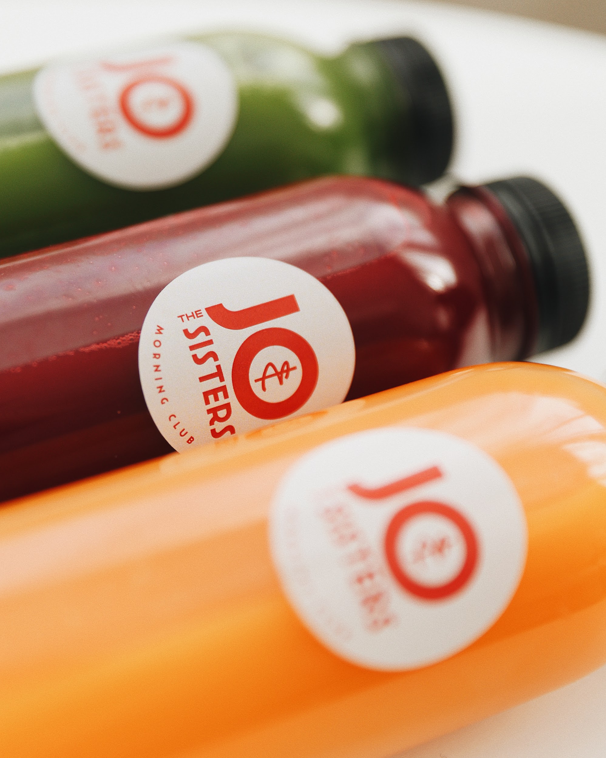 woman in black tank top holding clear wine glass