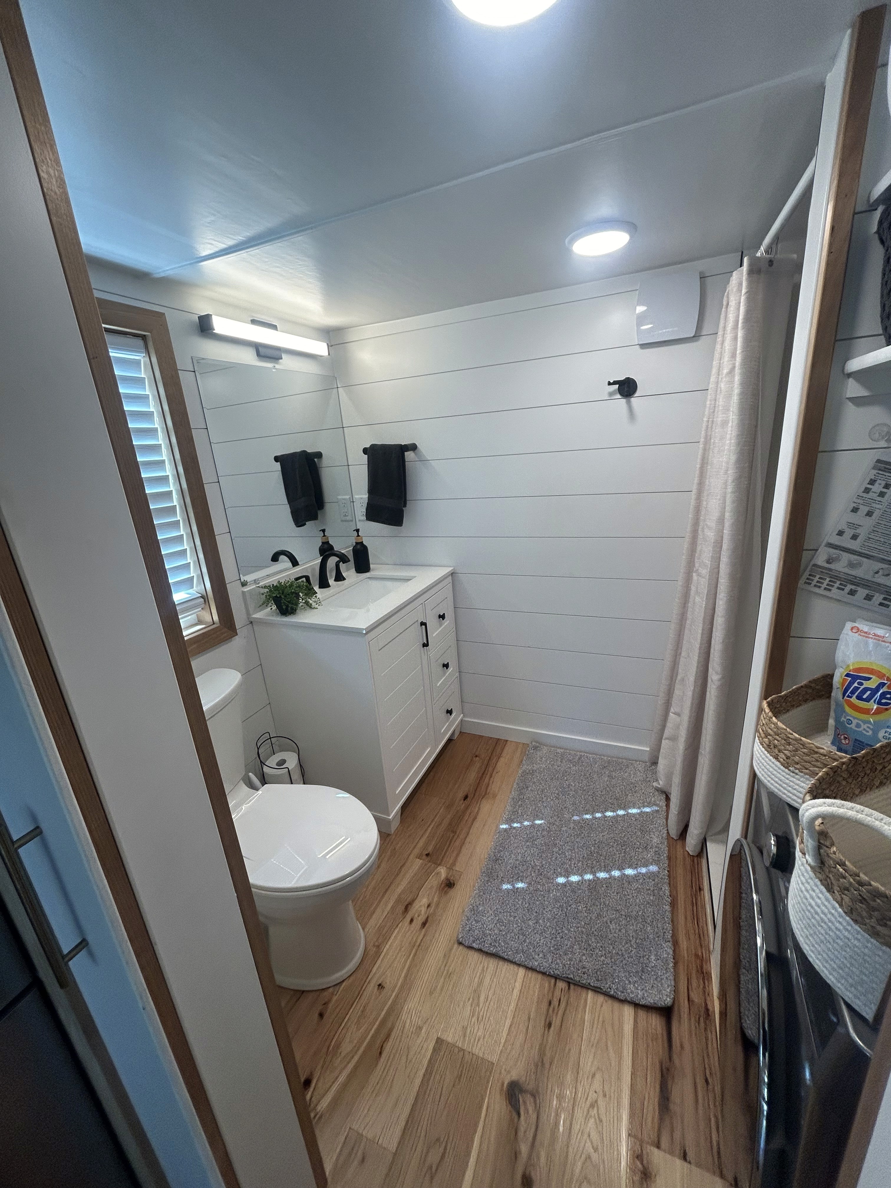 Retro-style kitchen with green cabinets, appliance garage, and storage designed for modern living in Southern Utah