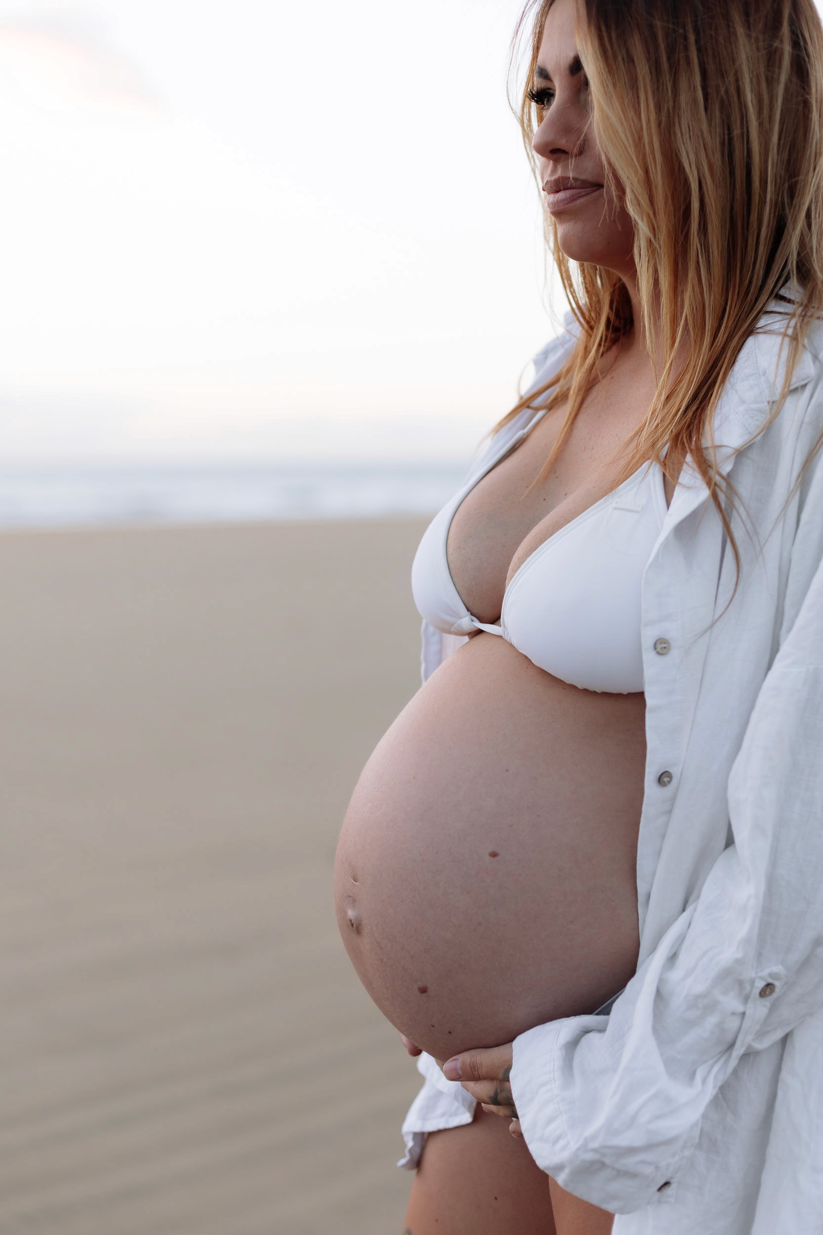 Maternity photography session on Mackay beach during early morning light