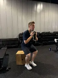 man in black hoodie standing