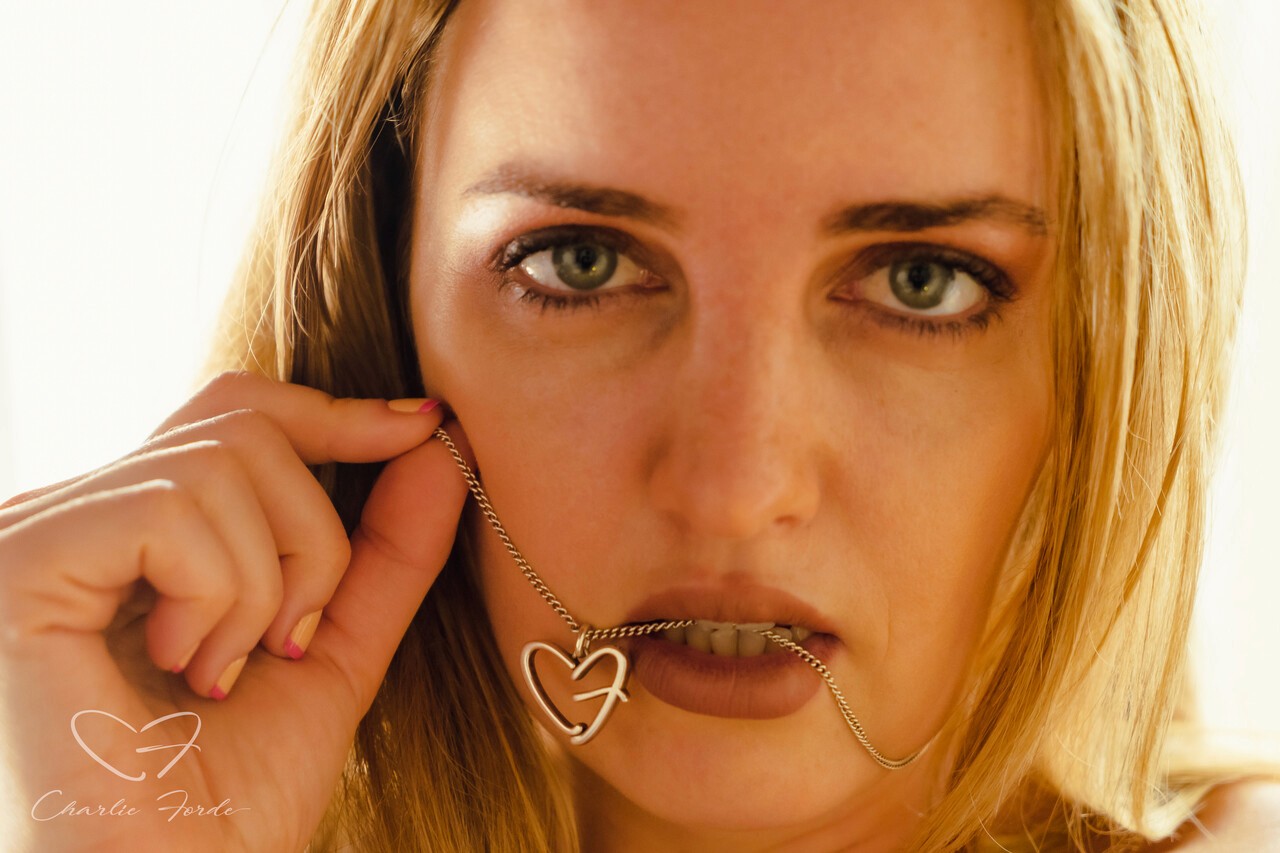 kids lying on a glass land and smiling
