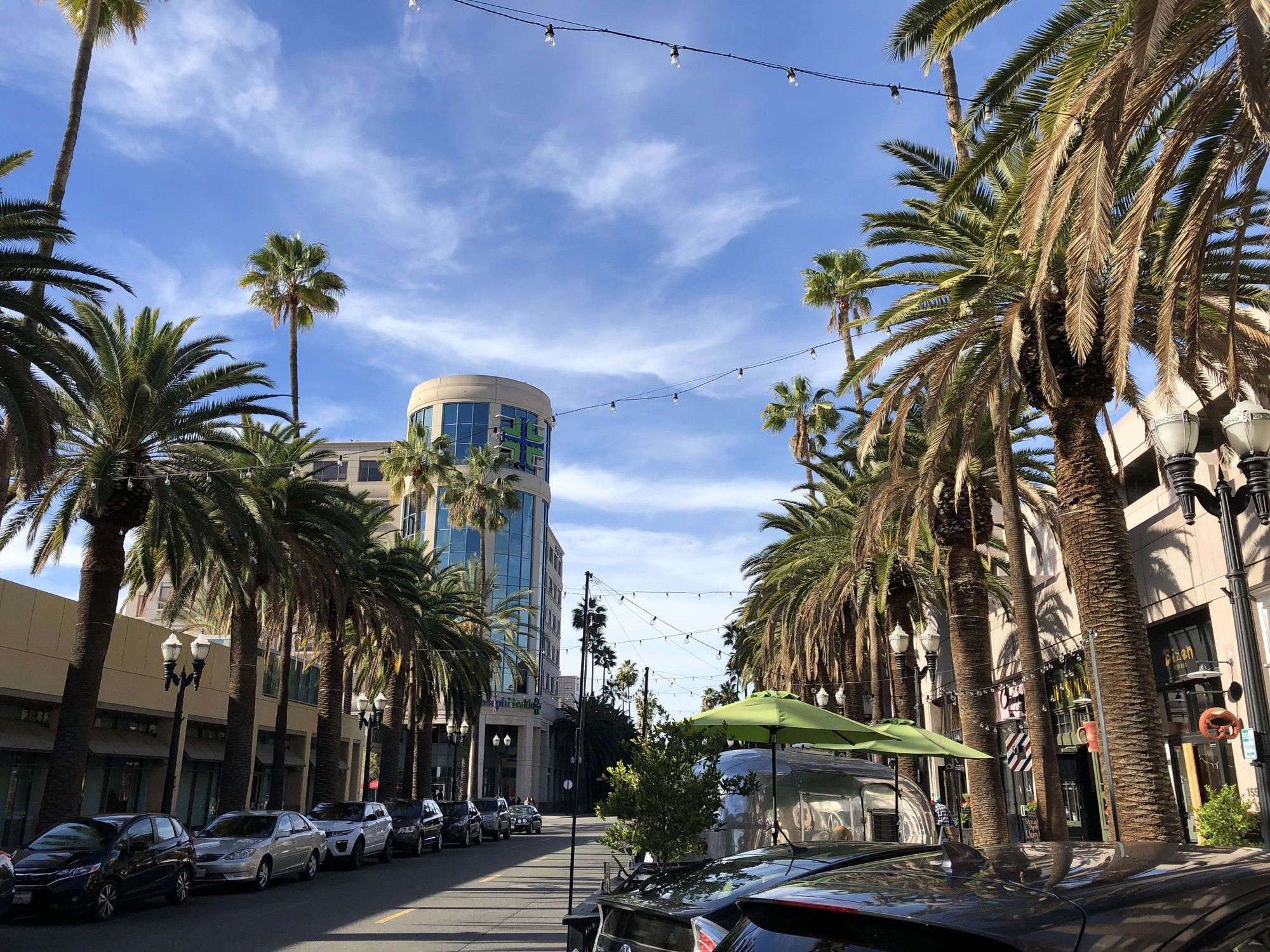 brown wooden beach lounge chair on beach during daytime