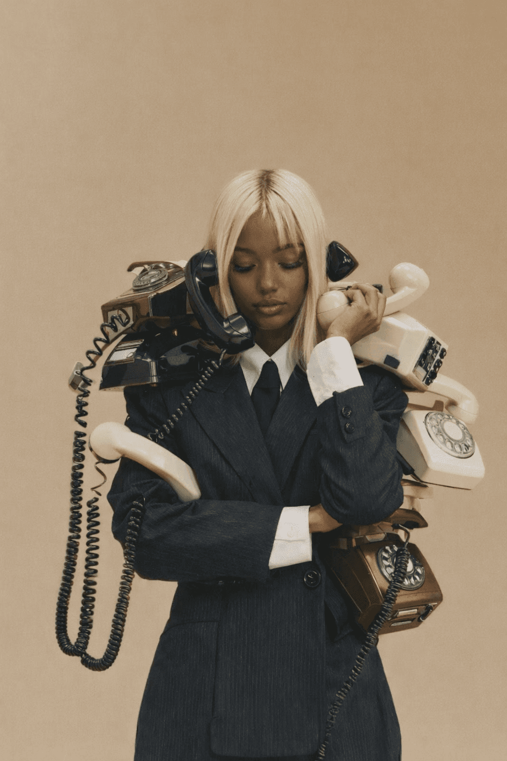 woman sitting around table holding tablet