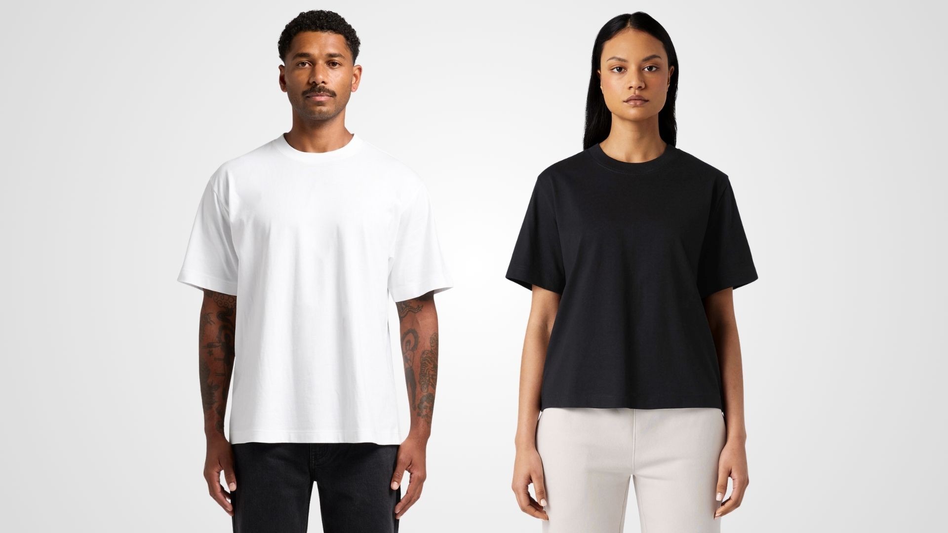 Both the mens and womens fit of the box tee shown on two models