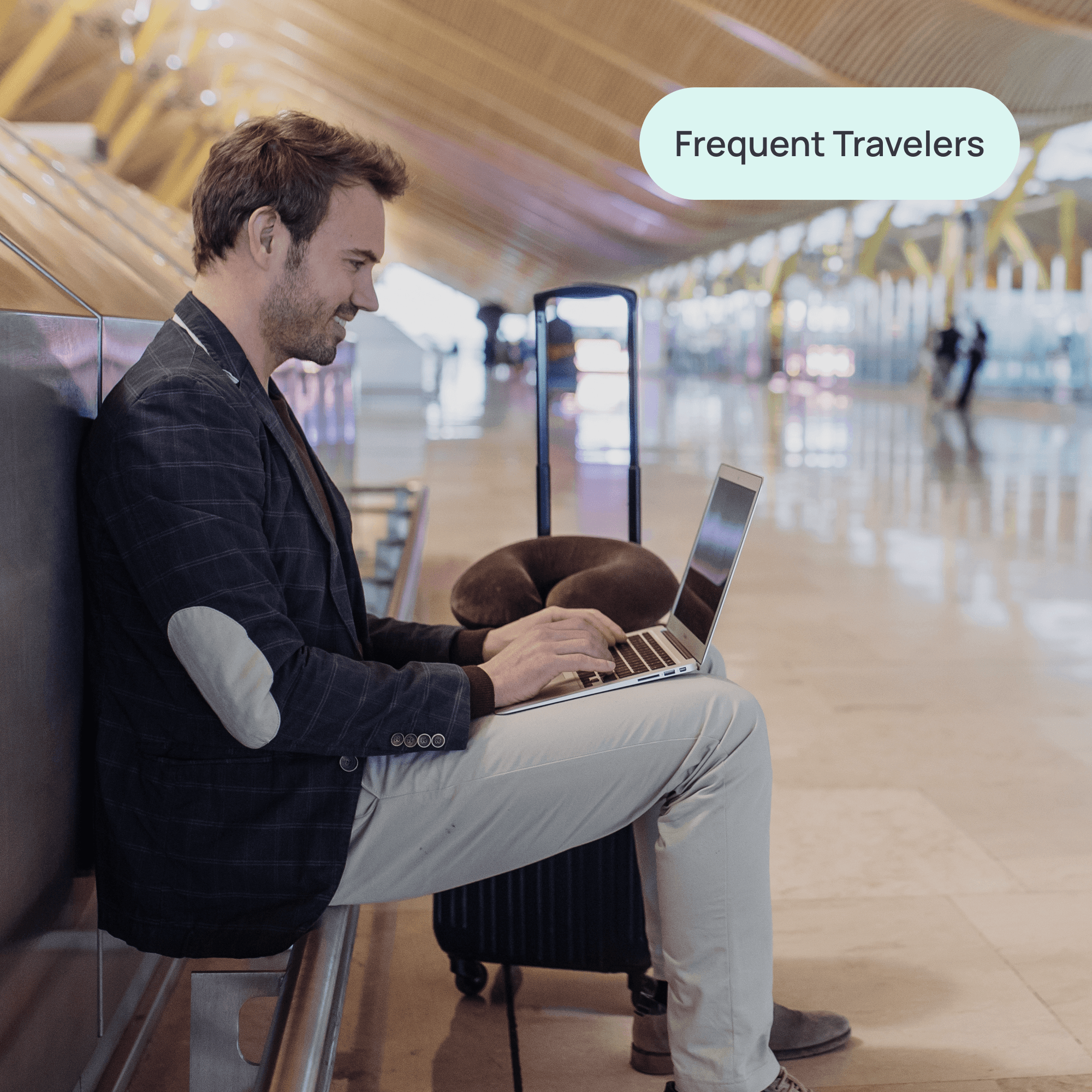 man sitting at airport on his laptop with label "frequent travelers"