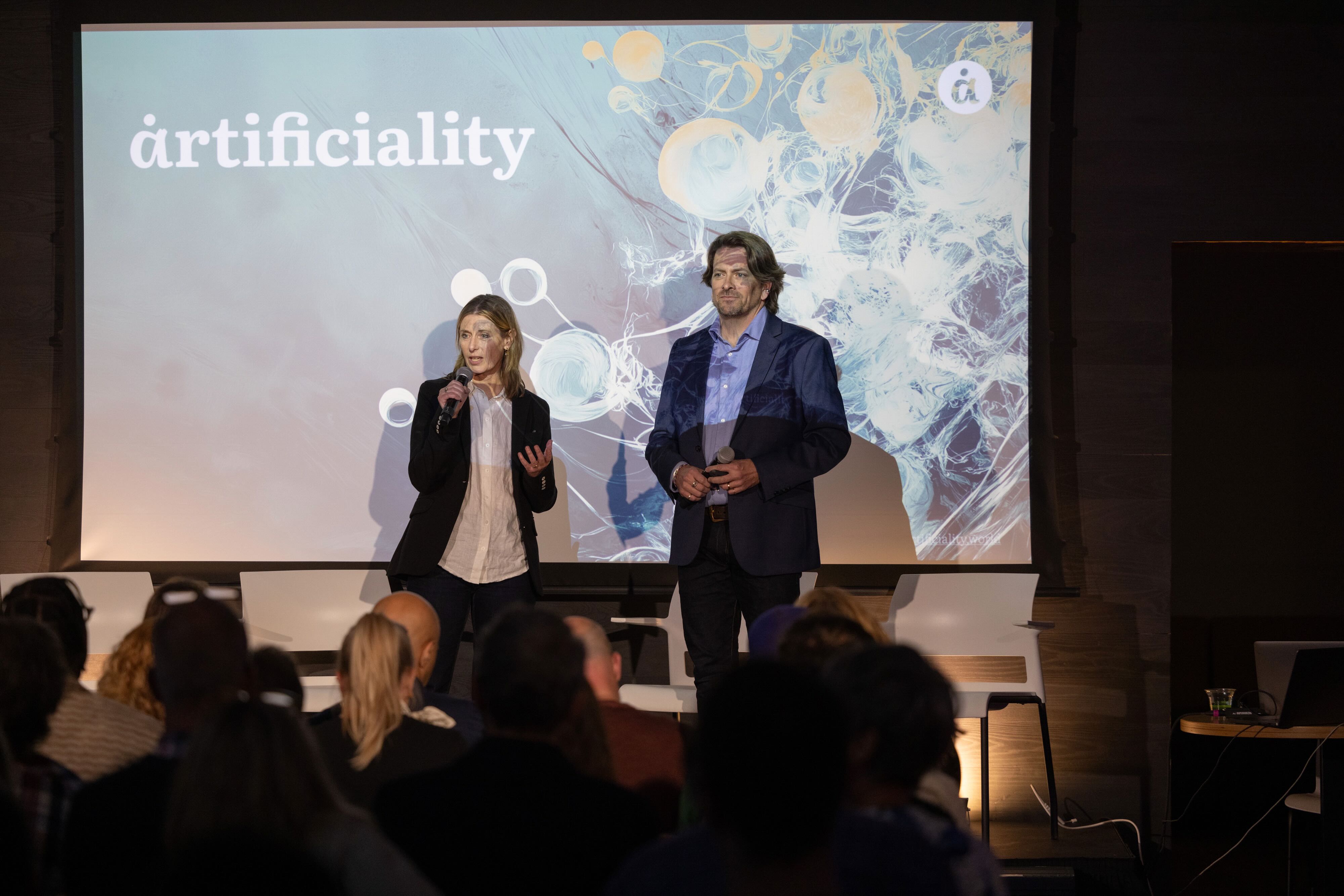 Helen Edwards and Dave Edwards delivering a keynote at the Artificiality Summit