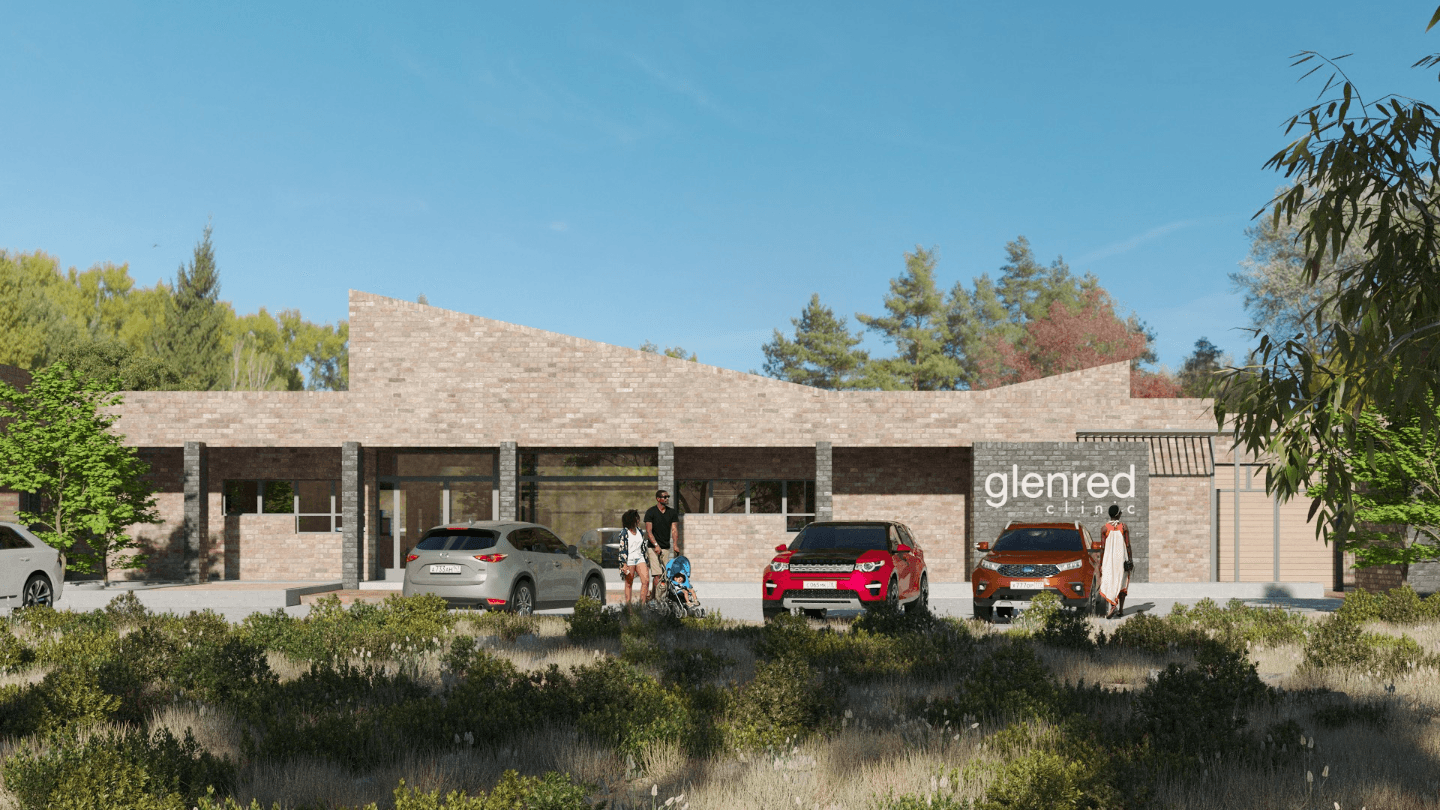 Modern brick architecture with cars in the parking lot and people walking about