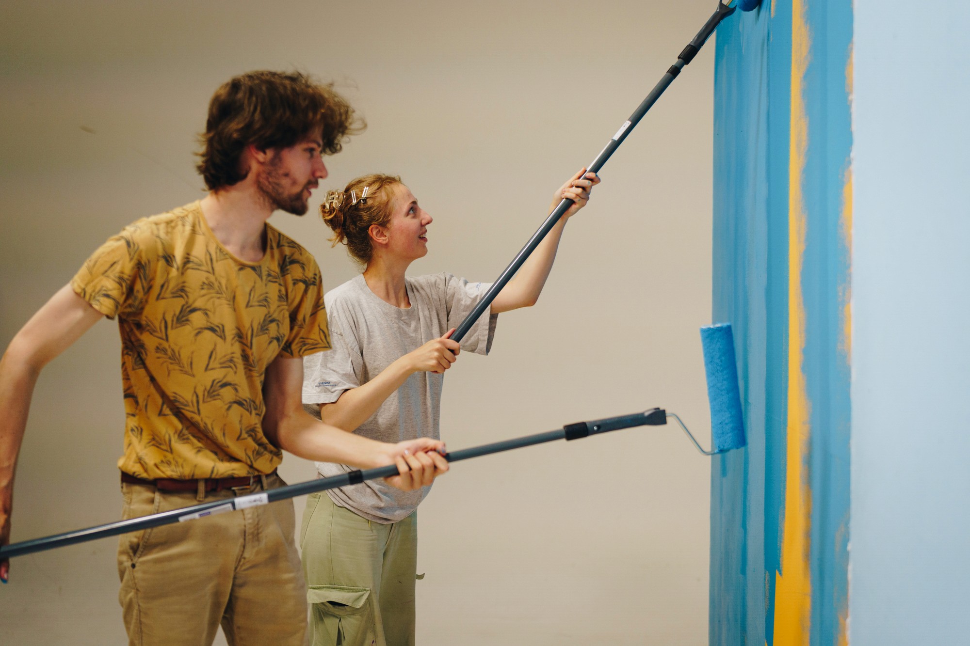 The image captures the ethereal beauty of an underwater cave illuminated by sunbeams penetrating through an opening above.