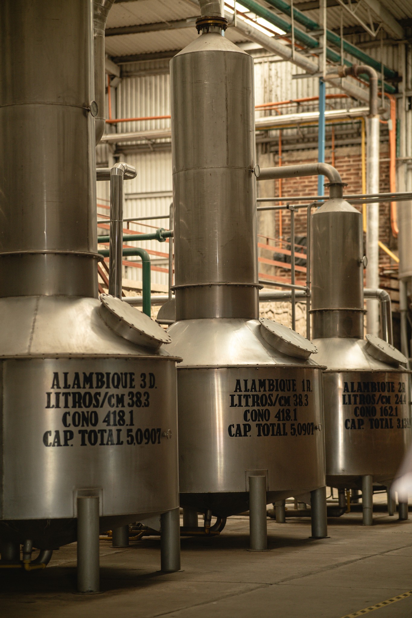 Stainless steel stills with copper-lined necks