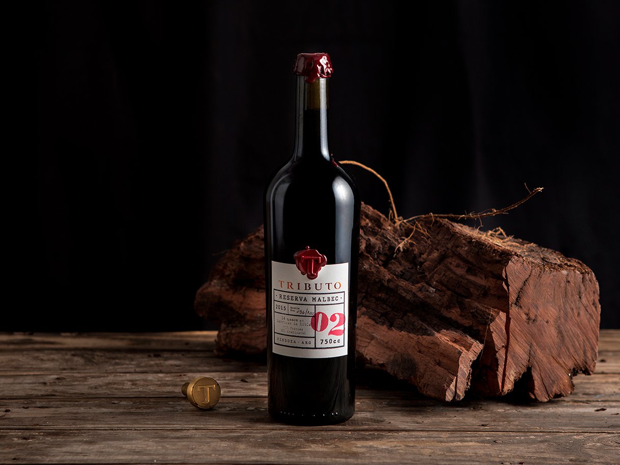 Rustic cabin in a golden field at sunset