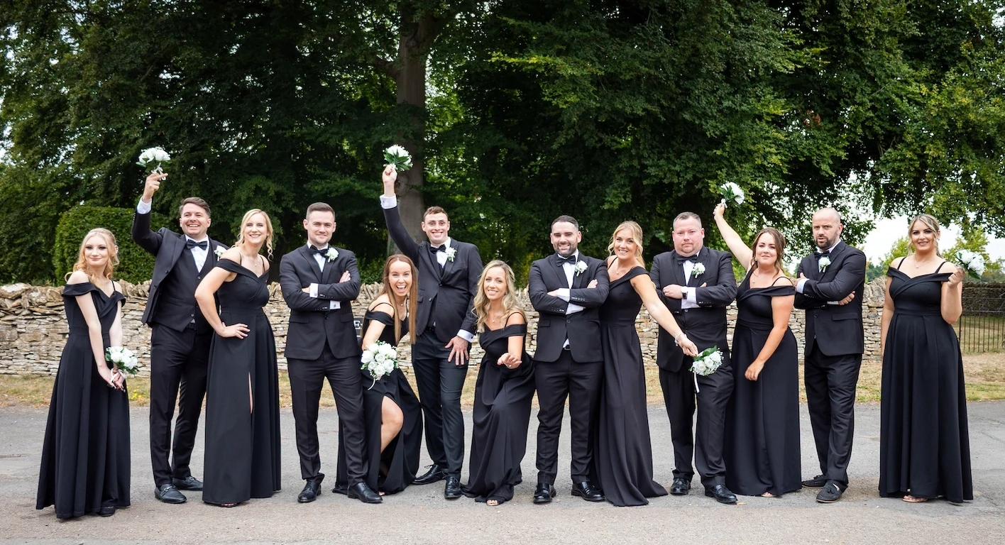 Bridal party group photo with bridesmaids and groomsmen in formal attire