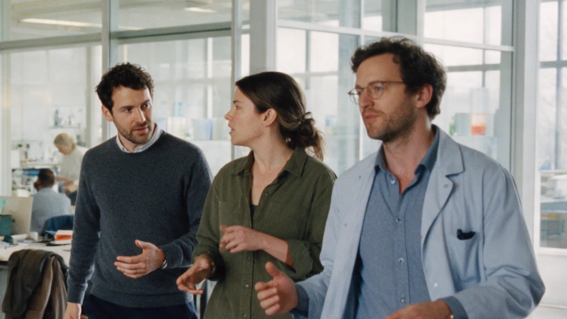 Company leadership walking through a laboratory