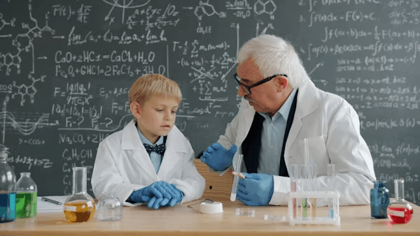High school student conducting earth science research with a PhD mentor reviewing geological data and maps