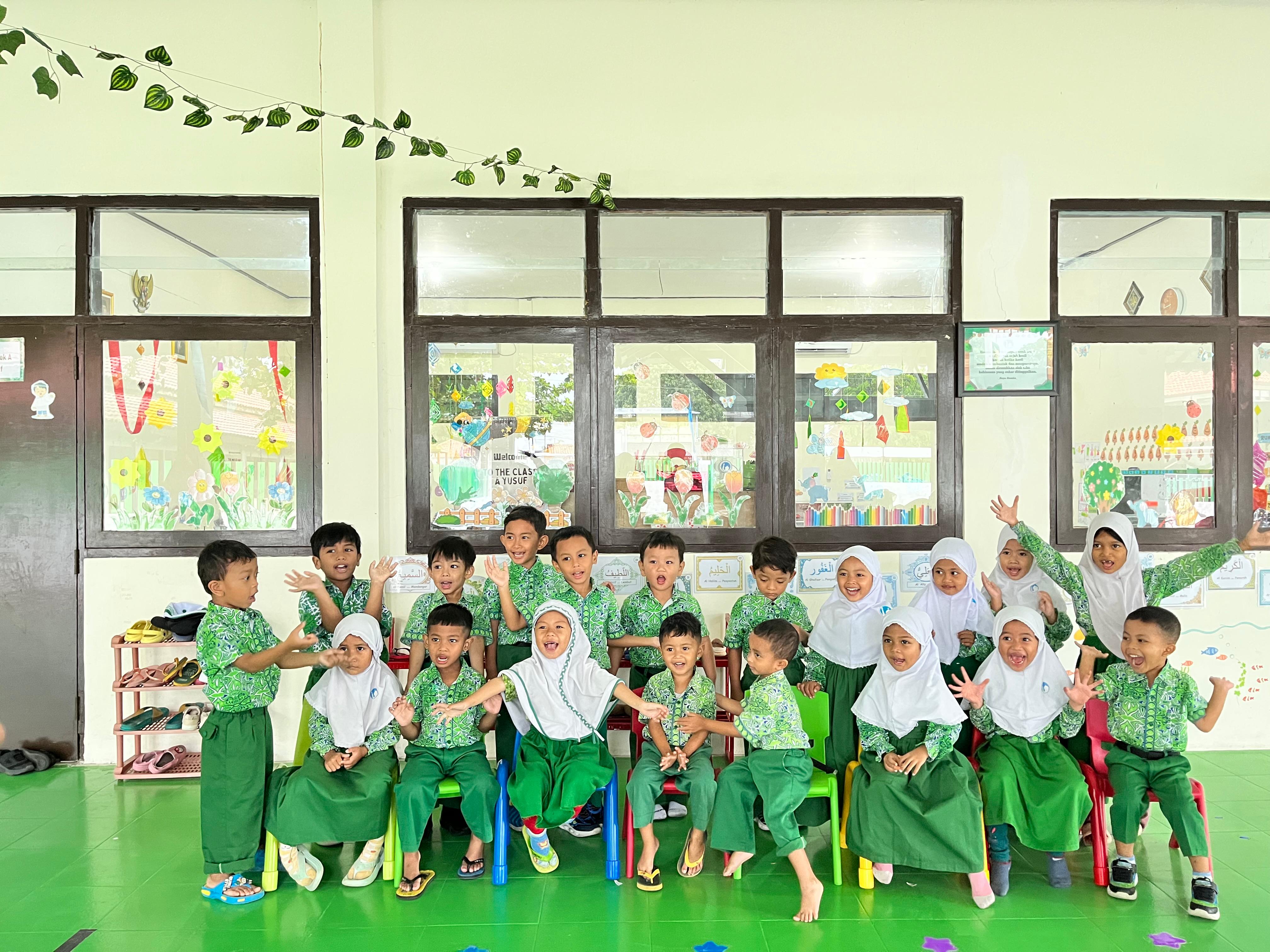 a group of young men sitting next to each other