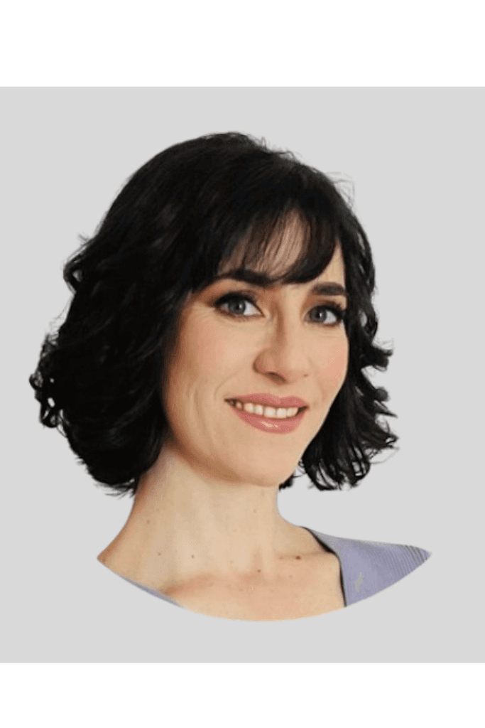 woman in black long sleeve shirt sitting on white couch