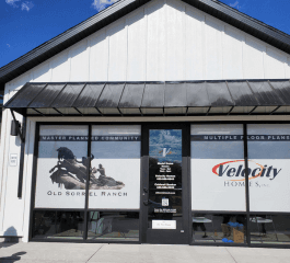 a man in a yellow shirt is working on a roof