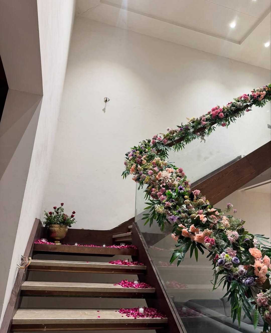 Staircase decorated with pastel flowers & rose petals for indoor wedding home decor in Burari, najafgarh, Rajouri Garden, NCR