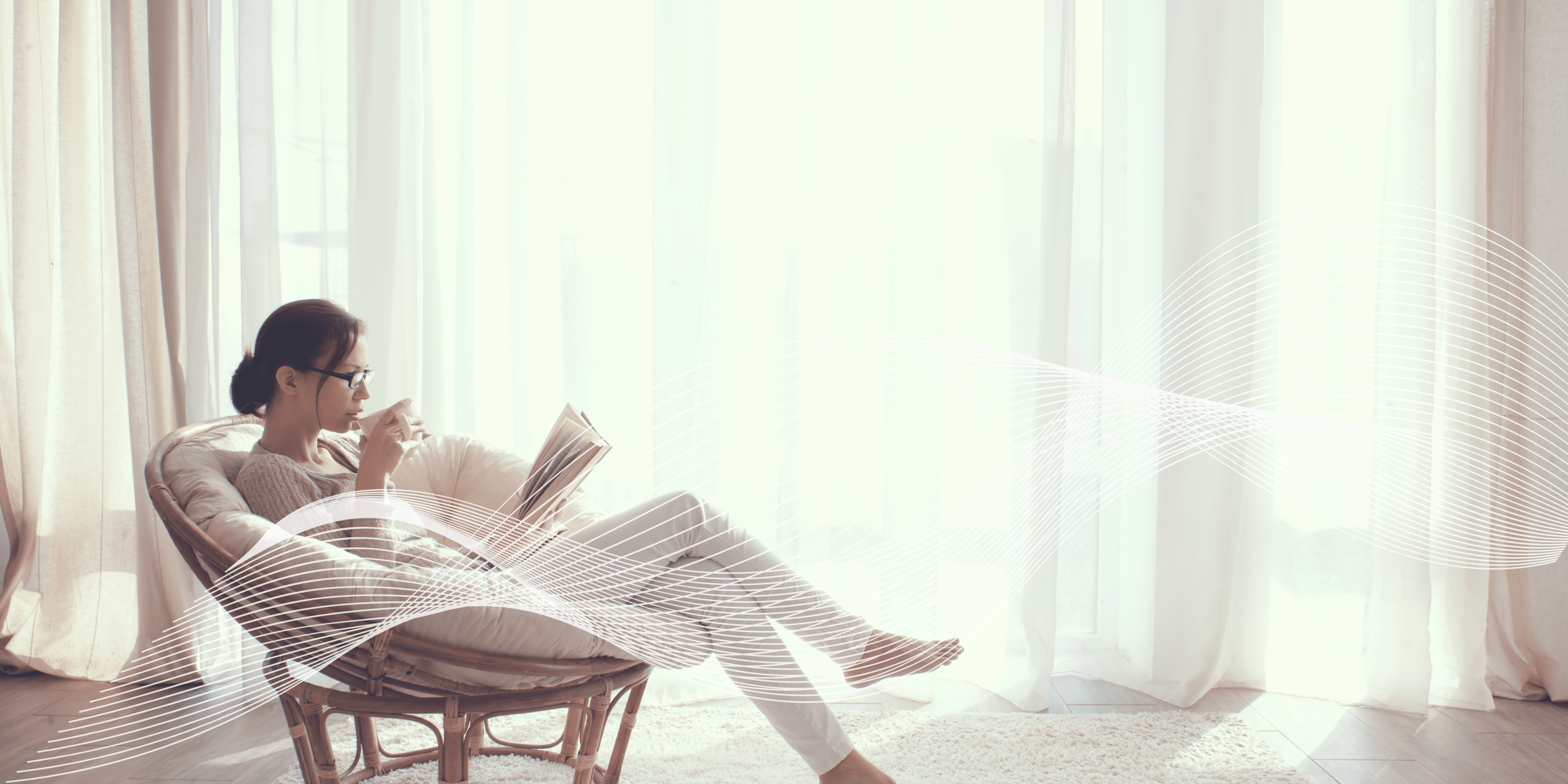 woman sitting on cliff overlooking mountains during daytime