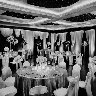 Wedding reception venue beautifully set up, with elegant decor and lighting, and NightStyle DJs providing the perfect ambiance for the celebration.