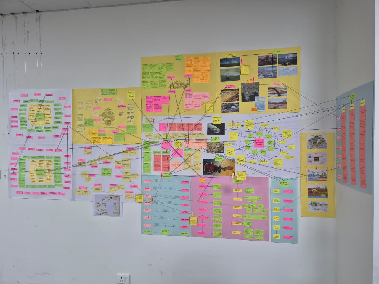 A fast black sports car races down the highway.