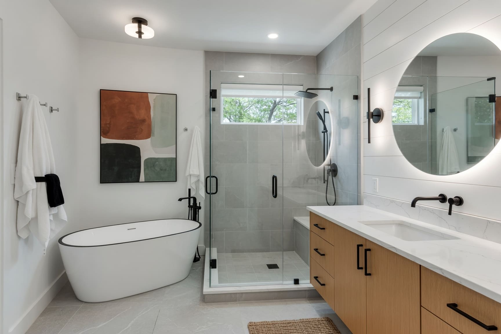 Bathroom with freestanding tub and walk-in glass shower